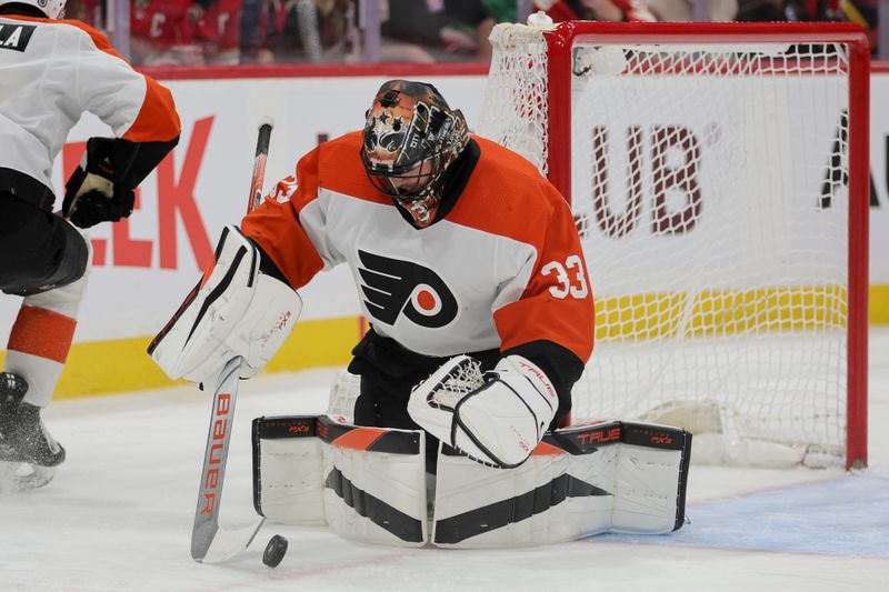 Feb 6, 2024; Sunrise, Florida, USA; Philadelphia Flyers goaltender Samuel Ersson (33) makes a save against the Florida Panthers during the second period at Amerant Bank Arena. Mandatory Credit: Sam Navarro-USA TODAY Sports