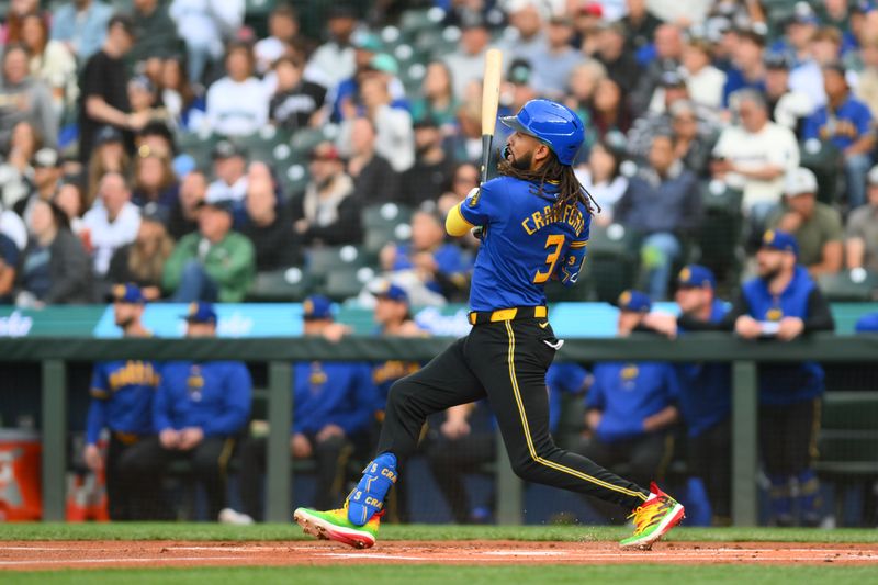 May 31, 2024; Seattle, Washington, USA; Seattle Mariners shortstop J.P. Crawford (3) hits a double against the Los Angeles Angels during the first inning at T-Mobile Park. Mandatory Credit: Steven Bisig-USA TODAY Sports