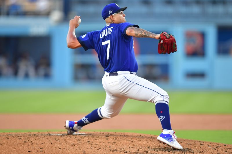 Jul 6, 2023; Los Angeles, California, USA; Los Angeles Dodgers starting pitcher Julio Urias (7) throws against the Pittsburgh Pirates during the second inning at Dodger Stadium. Mandatory Credit: Gary A. Vasquez-USA TODAY Sports