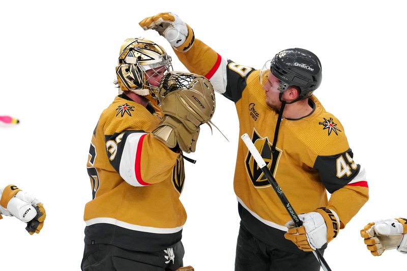 Mar 23, 2024; Las Vegas, Nevada, USA; Vegas Golden Knights center Ivan Barbashev (49) congratulates Vegas Golden Knights goaltender Logan Thompson (36) in a victory over the Columbus Blue Jackets at T-Mobile Arena. Mandatory Credit: Stephen R. Sylvanie-USA TODAY Sports