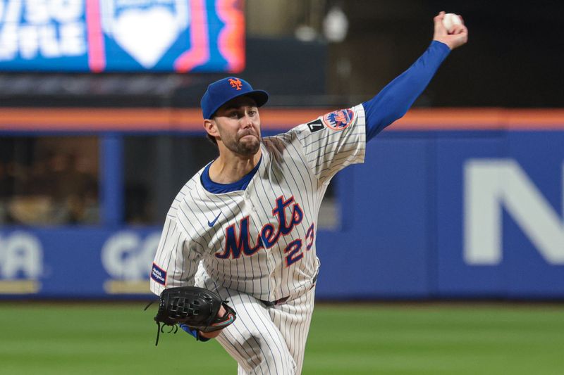 Sep 17, 2025; New York City, New York, USA; New York Mets starting pitcher David Peterson (23) delivers a pitch during the third inning against the San Diego Padres at Citi Field. Mandatory Credit: Vincent Carchietta-Imagn Images