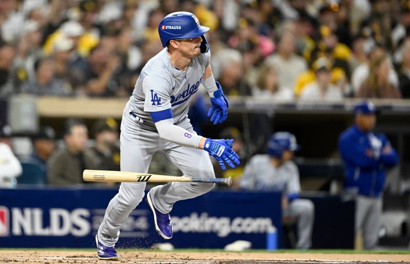 Oct 9, 2024; San Diego, California, USA; Los Angeles Dodgers third baseman Enrique Hernandez (8) singles in the second inning against the San Diego Padres during game four of the NLDS for the 2024 MLB Playoffs at Petco Park.  Mandatory Credit: Denis Poroy-Imagn Images