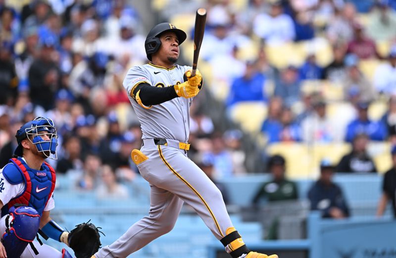 Apr 27, 2025; Los Angeles, California, USA; Pittsburgh Pirates first baseman Enmanuel Valdez (48) hits a home run during the first inning against the Los Angeles Dodgers at Dodger Stadium. Mandatory Credit: Jonathan Hui-Imagn Images
