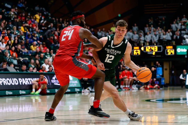 Mar 3, 2023; Fort Collins, Colorado, USA; Colorado State Rams forward Patrick Cartier (12) drives to the net against New Mexico Lobos forward Morris Udeze (24) in the second half at Moby Arena. Mandatory Credit: Isaiah J. Downing-USA TODAY Sports