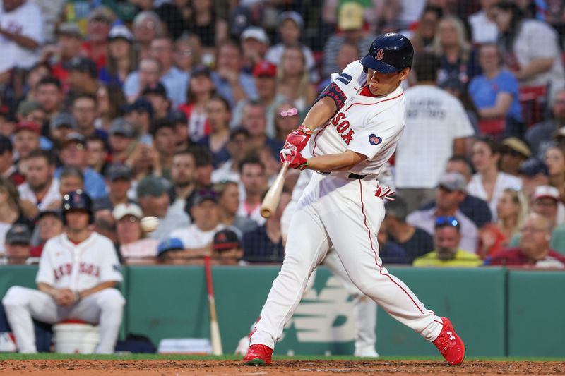 Jun 24, 2024; Boston, Massachusetts, USA; Boston Red Sox designated hitter Masataka Yoshida (7) hits a single during the fifth inning against the Toronto Blue Jays at Fenway Park. Mandatory Credit: Paul Rutherford-USA TODAY Sports