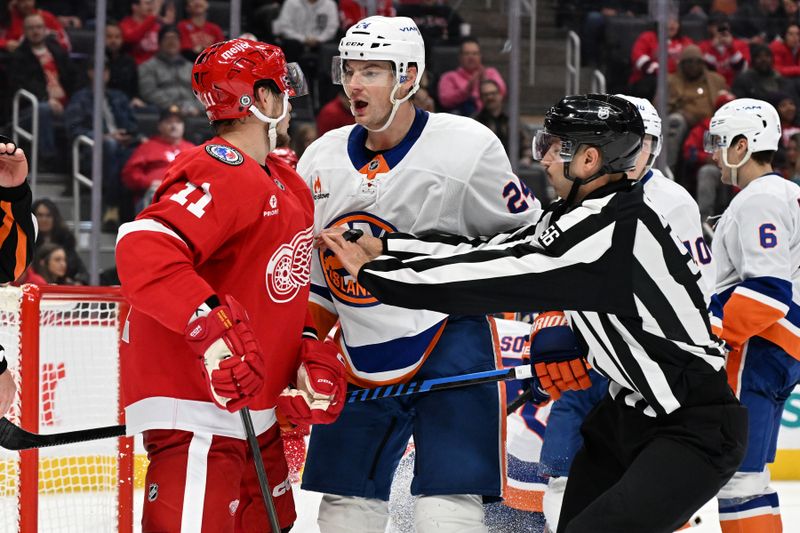 Nov 21, 2024; Detroit, Michigan, USA;  Detroit Red Wings right wing Vladimir Tarasenko (11) and New York Islanders defenseman Scott Mayfield (24) exchange words in the second period at Little Caesars Arena. Mandatory Credit: Lon Horwedel-Imagn Images