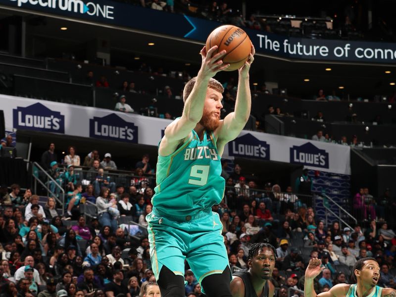 CHARLOTTE, NC - MARCH 9: Davis Bertans #9 of the Charlotte Hornets grabs the rebound during the game against the Brooklyn Nets on March 9, 2024 at Spectrum Center in Charlotte, North Carolina. NOTE TO USER: User expressly acknowledges and agrees that, by downloading and or using this photograph, User is consenting to the terms and conditions of the Getty Images License Agreement. Mandatory Copyright Notice: Copyright 2024 NBAE (Photo by Kent Smith/NBAE via Getty Images)