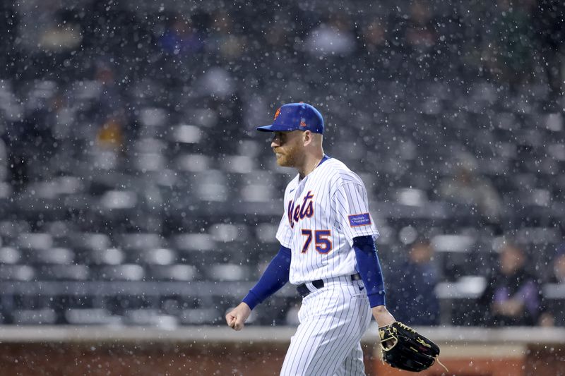 Sep 28, 2023; New York City, New York, USA; New York Mets relief pitcher Reed Garrett (75) walks off the field after the umpires stop the game against the Miami Marlins for a rain delay during the ninth inning at Citi Field. Mandatory Credit: Brad Penner-USA TODAY Sports