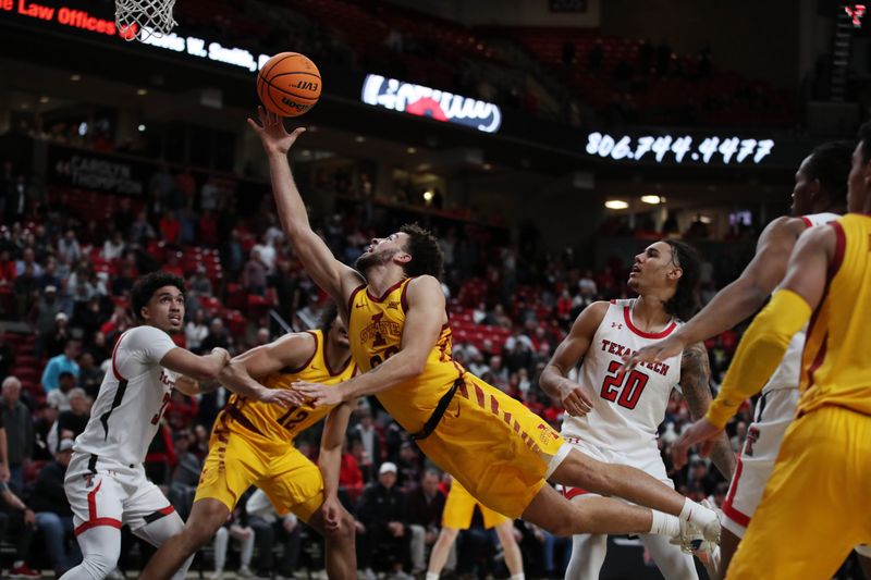 Jan 30, 2023; Lubbock, Texas, USA;  Iowa State Cyclones guard Gabe Kalscheur (22) goes to the basket in front of Texas Tech Red Raiders guard Jaylon Tyson (20) in overtime at United Supermarkets Arena. Mandatory Credit: Michael C. Johnson-USA TODAY Sports