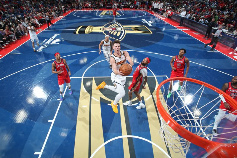 NEW ORLEANS, LA - NOVEMBER 15: Christian Braun #0 of the Denver Nuggets drives to the basket during the game against the New Orleans Pelicans during the Emirates NBA Cup game on November 15, 2024 at the Smoothie King Center in New Orleans, Louisiana. NOTE TO USER: User expressly acknowledges and agrees that, by downloading and or using this Photograph, user is consenting to the terms and conditions of the Getty Images License Agreement. Mandatory Copyright Notice: Copyright 2024 NBAE (Photo by Layne Murdoch Jr./NBAE via Getty Images)