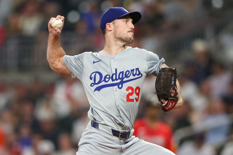 Sep 13, 2024; Atlanta, Georgia, USA; Los Angeles Dodgers relief pitcher Michael Grove (29) throws against the Atlanta Braves in the third inning at Truist Park. Mandatory Credit: Brett Davis-Imagn Images