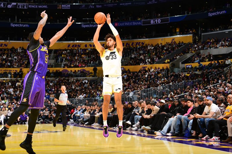 LOS ANGELES, CA - NOVEMBER 19: Johnny Juzang #33 of the Utah Jazz shoots a three point basket during the game against the Los Angeles Lakers during the Emirates NBA Cup game on November 19, 2024 at Crypto.Com Arena in Los Angeles, California. NOTE TO USER: User expressly acknowledges and agrees that, by downloading and/or using this Photograph, user is consenting to the terms and conditions of the Getty Images License Agreement. Mandatory Copyright Notice: Copyright 2024 NBAE (Photo by Adam Pantozzi/NBAE via Getty Images)