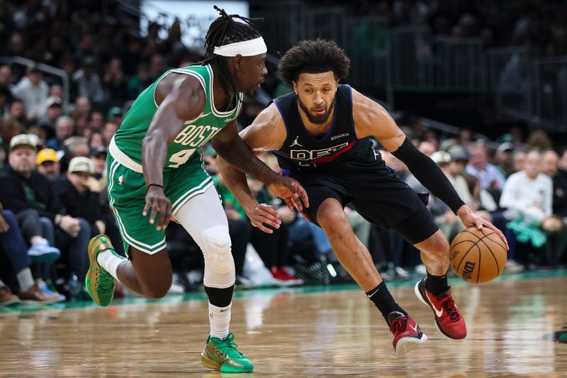 BOSTON, MA - DECEMBER 12: Cade Cunningham #2 of the Detroit Pistons goes to the basket while guarded by Jrue Holiday #4 of the Boston Celtics during the second quarter of a game at TD Garden on December 12, 2024 in Boston, Massachusetts. NOTE TO USER: User expressly acknowledges and agrees that, by downloading and or using this photograph, User is consenting to the terms and conditions of the Getty Images License Agreement. (Photo by Adam Glanzman/Getty Images)