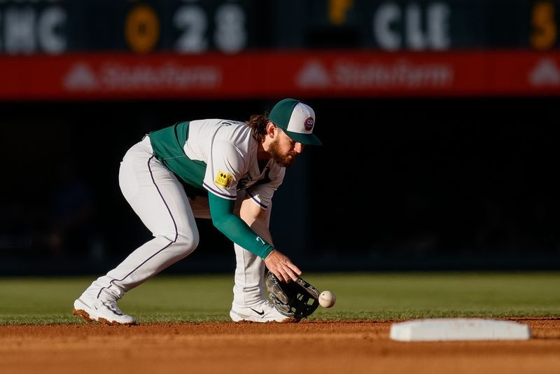 Jul 6, 2024; Denver, Colorado, USA; Colorado Rockies second baseman Brendan Rodgers (7) fields the ball in the first inning against the Kansas City Royals at Coors Field. Mandatory Credit: Isaiah J. Downing-USA TODAY Sports