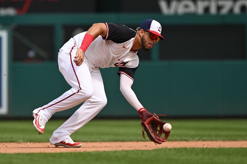 Sep 1, 2024; Washington, District of Columbia, USA; Washington Nationals second baseman Luis Garcia Jr. (2) fields a ground ball against the Chicago Cubs during the fifth inning at Nationals Park. Mandatory Credit: Rafael Suanes-USA TODAY Sports