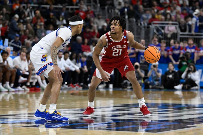 Mar 20, 2025; Providence, RI, USA;  Arkansas Razorbacks guard D.J. Wagner (21) controls the ball against ks- during the second half at Amica Mutual Pavilion. Mandatory Credit: Eric Canha-Imagn Images