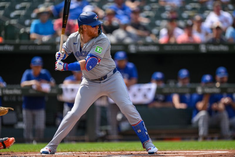 Jul 29, 2024; Baltimore, Maryland, USA; Toronto Blue Jays first base Justin Turner (2) bats against the Baltimore Orioles during the first inning at Oriole Park at Camden Yards. Mandatory Credit: Reggie Hildred-USA TODAY Sports