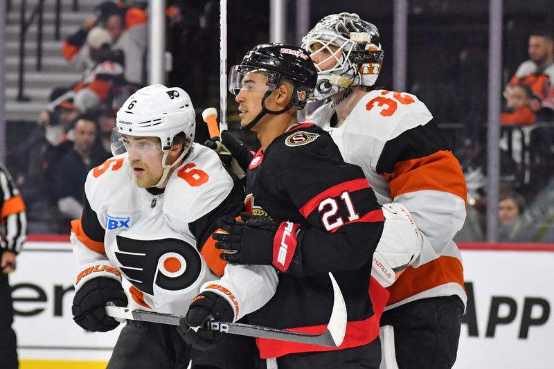 Mar 2, 2024; Philadelphia, Pennsylvania, USA; Ottawa Senators right wing Mathieu Joseph (21) battles for position with Philadelphia Flyers defenseman Travis Sanheim (6) in front of goaltender Felix Sandstrom (32) during the second period at Wells Fargo Center. Mandatory Credit: Eric Hartline-USA TODAY Sports