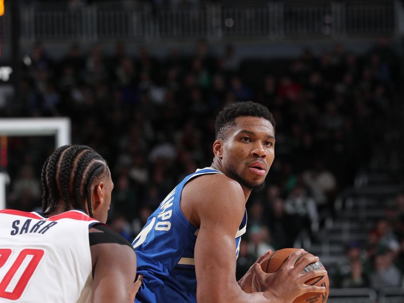 MILWAUKEE, WI - NOVEMBER 30: Giannis Antetokounmpo #34 of the Milwaukee Bucks handles the ball during the game against the Washington Wizards on November 30, 2024 at Fiserv Forum Center in Milwaukee, Wisconsin. NOTE TO USER: User expressly acknowledges and agrees that, by downloading and or using this Photograph, user is consenting to the terms and conditions of the Getty Images License Agreement. Mandatory Copyright Notice: Copyright 2024 NBAE (Photo by Gary Dineen/NBAE via Getty Images).