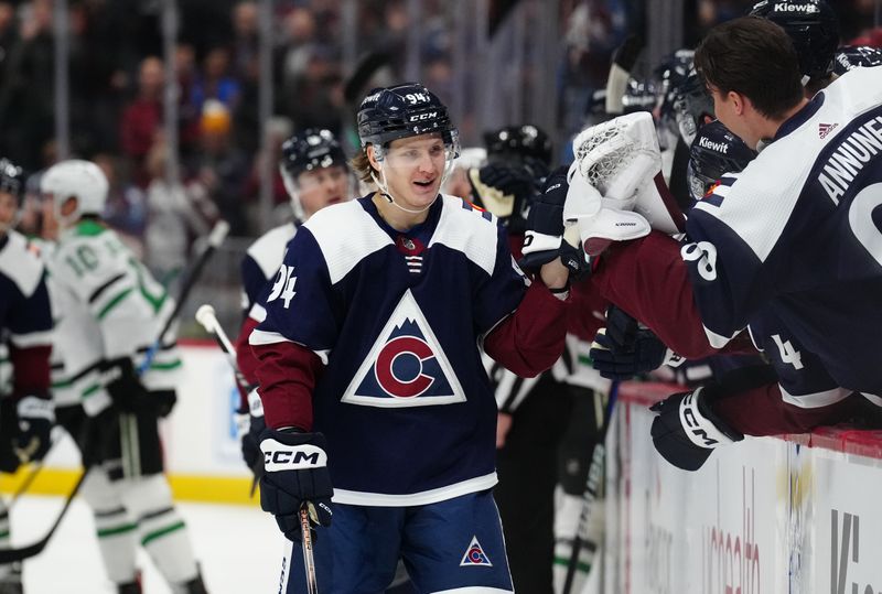 Feb 27, 2024; Denver, Colorado, USA; Colorado Avalanche left wing Joel Kiviranta (94) celebrates his first period goal against the Dallas Stars at Ball Arena. Mandatory Credit: Ron Chenoy-USA TODAY Sports