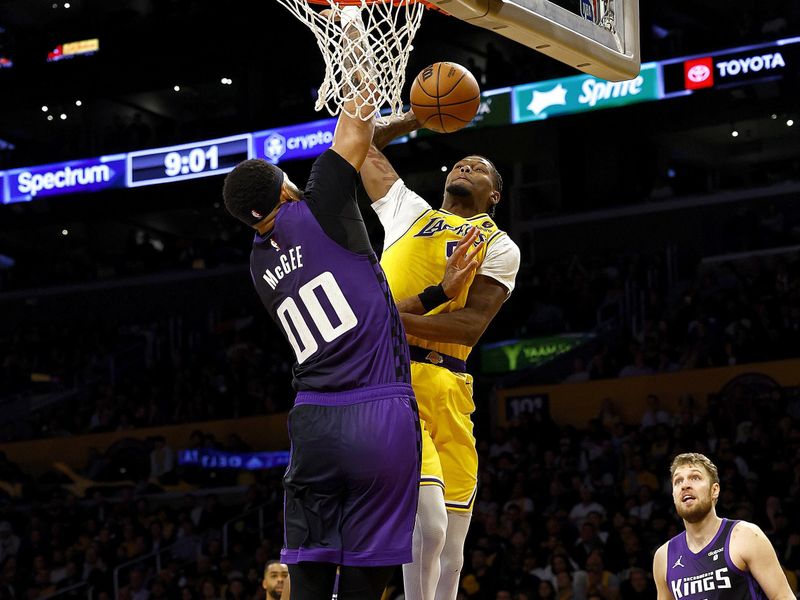 LOS ANGELES, CALIFORNIA - NOVEMBER 15:  Cam Reddish #5 of the Los Angeles Lakers takes a shot against JaVale McGee #00 of the Sacramento Kings in the third quarter at Crypto.com Arena on November 15, 2023 in Los Angeles, California.  NOTE TO USER: User expressly acknowledges and agrees that, by downloading and/or using this photograph, user is consenting to the terms and conditions of the Getty Images License Agreement. (Photo by Ronald Martinez/Getty Images)