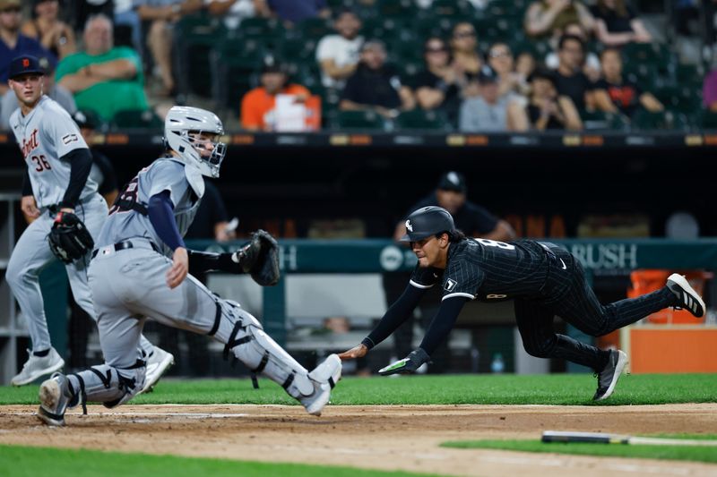 Aug 26, 2024; Chicago, Illinois, USA; Chicago White Sox second baseman Nicky Lopez (8) scores against the Detroit Tigers during the third inning at Guaranteed Rate Field. Mandatory Credit: Kamil Krzaczynski-USA TODAY Sports