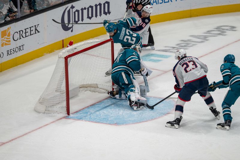 Nov 5, 2024; San Jose, California, USA;  San Jose Sharks goaltender Vitek Vanecek (41) makes a save against Columbus Blue Jackets center Sean Monahan (23) during the third period at SAP Center at San Jose. Mandatory Credit: Neville E. Guard-Imagn Images