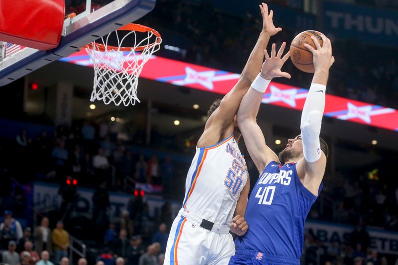 OKLAHOMA CITY, OKLAHOMA - OCTOBER 25: Ivica Zubac #40 of the Los Angeles Clippers shoots over Jeremiah Robinson-Earl #50 of the Oklahoma City Thunder during the first quarter at Paycom Center on October 25, 2022 in Oklahoma City, Oklahoma. NOTE TO USER: User expressly acknowledges and agrees that, by downloading and or using this photograph, User is consenting to the terms and conditions of the Getty Images License Agreement.  (Photo by Ian Maule/Getty Images)