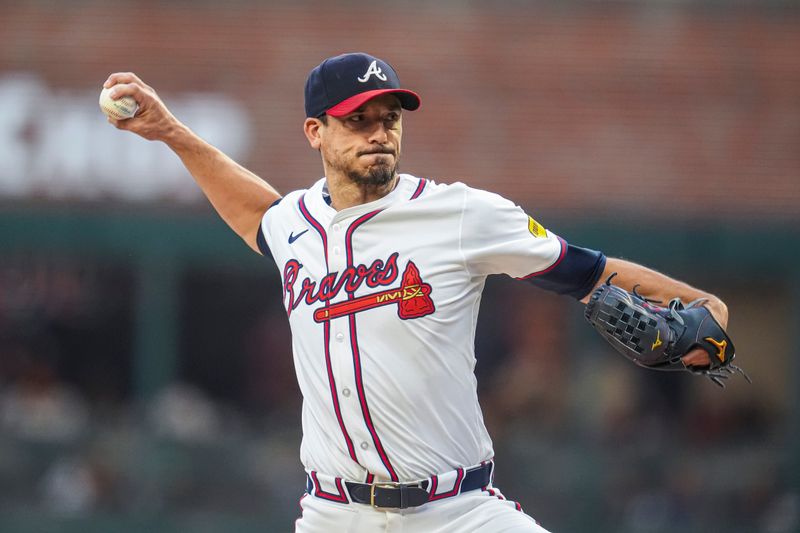 Sep 4, 2024; Cumberland, Georgia, USA; Atlanta Braves pitcher Charlie Morton (50) pitches against the Colorado Rockies during the first inning at Truist Park. Mandatory Credit: Dale Zanine-Imagn Images