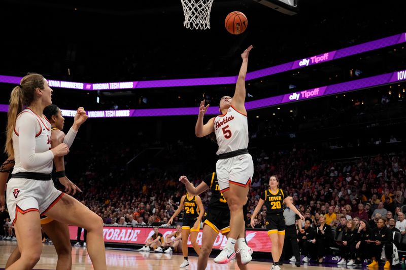 Nov 9, 2023; Charlotte, North Carolina, USA; Virginia Tech Hokies guard Georgia Amoore (5) goes up for a layup against the Iowa Hawkeyes during the first half at Spectrum Center. Mandatory Credit: Jim Dedmon-USA TODAY Sports