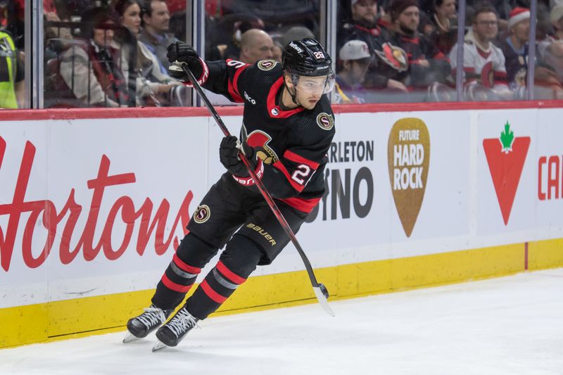 Dec 23, 2023; Ottawa, Ontario, CAN; Ottawa Senators defenseman Erik Brannstrom (26) carries the puck on his stick in the second period against the Pittsburgh Penguins at the Canadian Tire Centre. Mandatory Credit: Marc DesRosiers-USA TODAY Sports