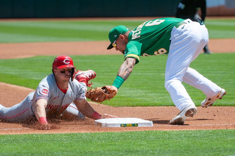 Apr 29, 2023; Oakland, California, USA; Oakland Athletics third baseman Jace Peterson (6) tags out Cincinnati Reds first baseman Spencer Steer (7) at third base during the first inning at RingCentral Coliseum. Mandatory Credit: Ed Szczepanski-USA TODAY Sports