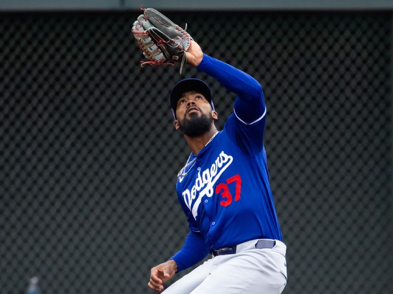 Feb 26, 2024; Salt River Pima-Maricopa, Arizona, USA; Los Angeles Dodgers outfielder Teoscar Hernandez catches a fly ball against the Colorado Rockies during a spring training game at Salt River Fields at Talking Stick. Mandatory Credit: Mark J. Rebilas-USA TODAY Sports