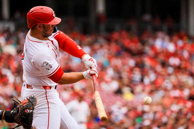 Sep 22, 2024; Cincinnati, Ohio, USA; Cincinnati Reds first baseman Ty France (2) hits a single in the second inning against the Pittsburgh Pirates at Great American Ball Park. Mandatory Credit: Katie Stratman-Imagn Images