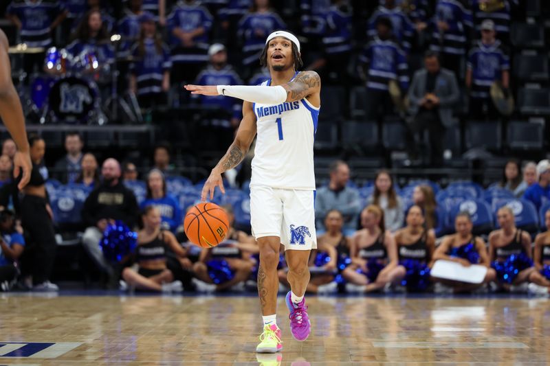 Dec 31, 2025; Memphis, Tennessee, USA; Memphis Tigers guard Dug McDaniel (1) calls a play against the North Texas Mean Green during the first half at FedExForum. Mandatory Credit: Wesley Hale-Imagn Images
