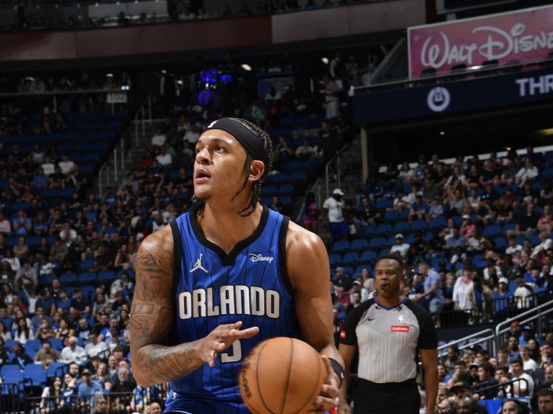 ORLANDO, FL - APRIL 1: Paolo Banchero #5 of the Orlando Magic handles the ball during the game against the Portland Trail Blazers on April 1, 2024 at Kia Center in Orlando, Florida. NOTE TO USER: User expressly acknowledges and agrees that, by downloading and or using this photograph, User is consenting to the terms and conditions of the Getty Images License Agreement. Mandatory Copyright Notice: Copyright 2024 NBAE (Photo by Fernando Medina/NBAE via Getty Images)