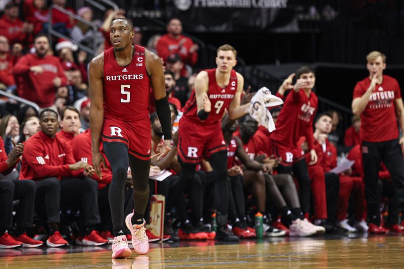 Dec 23, 2023; Newark, NY, USA; Rutgers Scarlet Knights forward Aundre Hyatt (5) reacts after a three point basket during the second half against the Mississippi State Bulldogs at Prudential Center. Mandatory Credit: Vincent Carchietta-USA TODAY Sports