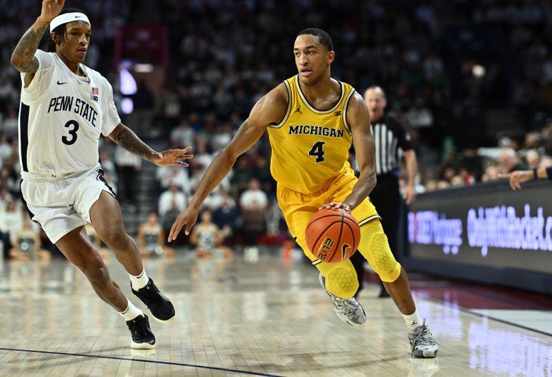 Jan 7, 2024; Philadelphia, Pennsylvania, USA; Michigan Wolverines guard Nimari Burnett (4) controls the ball against Penn State Nittany Lions guard Nick Kern Jr (3) in the second half at The Palestra. Mandatory Credit: Kyle Ross-USA TODAY Sports