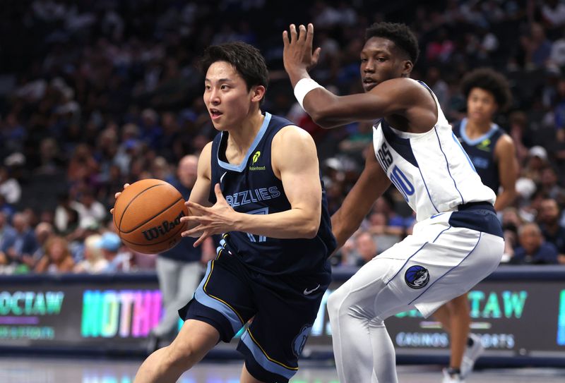 DALLAS, TX - OCTOBER 7: Yuki Kawamura #17 of the Memphis Grizzlies drives around Jazian Gortman #00 of the Dallas Mavericks  in the second half of a preseason game at American Airlines Center on October 7, 2024 in Dallas, Texas. NOTE TO USER: User expressly acknowledges and agrees that, by downloading and or using this photograph, User is consenting to the terms and conditions of the Getty Images License Agreement. (Photo by Ron Jenkins/Getty Images)