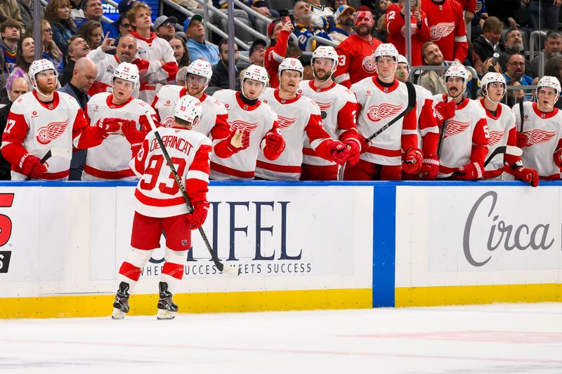 Oct 28, 2025; St. Louis, Missouri, USA; Detroit Red Wings right wing Alex Debrincat (93) is congratulated by teammates after scoring against the St. Louis Blues during the first period at Enterprise Center. Mandatory Credit: Jeff Curry-Imagn Images