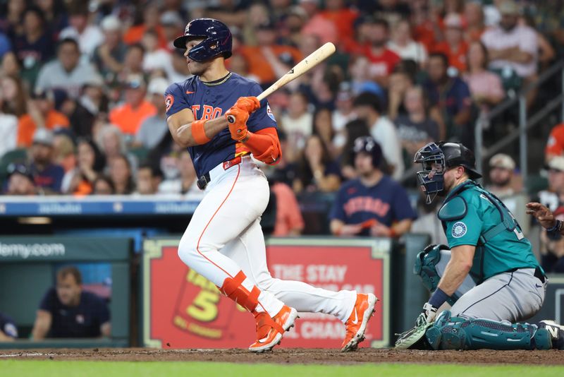 May 25, 2025; Houston, Texas, USA; Houston Astros right fielder Cam Smith (11) hits a single during the second inning against the Seattle Mariners at Daikin Park. Mandatory Credit: Troy Taormina-Imagn Images