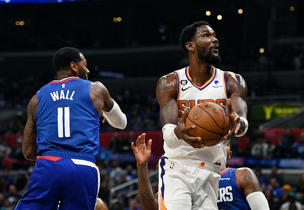 LOS ANGELES, CA - OCTOBER 23: Deandre Ayton #22 of the Phoenix Suns shoots basket against John Wall #11 of the Los Angeles Clippers during the second half at Crypto.com Arena on October 23, 2022 in Los Angeles, California. NOTE TO USER: User expressly acknowledges and agrees that, by downloading and or using this photograph, User is consenting to the terms and conditions of the Getty Images License Agreement. (Photo by Kevork Djansezian/Getty Images)