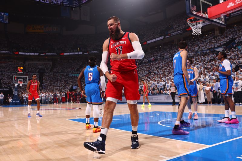 OKLAHOMA CITY, OK - APRIL 24: Jonas Valanciunas #17 of the New Orleans Pelicans celebrates during the game against the Oklahoma City Thunder during Round 1 Game 2 of the 2024 NBA Playoffs on April 24, 2024 at Paycom Arena in Oklahoma City, Oklahoma. NOTE TO USER: User expressly acknowledges and agrees that, by downloading and or using this photograph, User is consenting to the terms and conditions of the Getty Images License Agreement. Mandatory Copyright Notice: Copyright 2024 NBAE (Photo by Zach Beeker/NBAE via Getty Images)