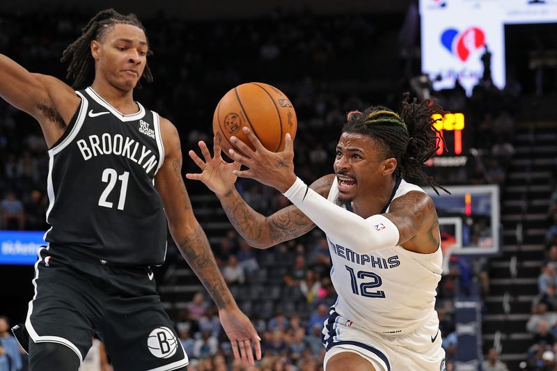 MEMPHIS, TENNESSEE - OCTOBER 30: Ja Morant #12 of the Memphis Grizzlies goes to the basket against Noah Clowney #21 of the Brooklyn Nets during the second half at FedExForum on October 30, 2024 in Memphis, Tennessee. NOTE TO USER: User expressly acknowledges and agrees that, by downloading and or using this photograph, User is consenting to the terms and conditions of the Getty Images License Agreement. (Photo by Justin Ford/Getty Images)