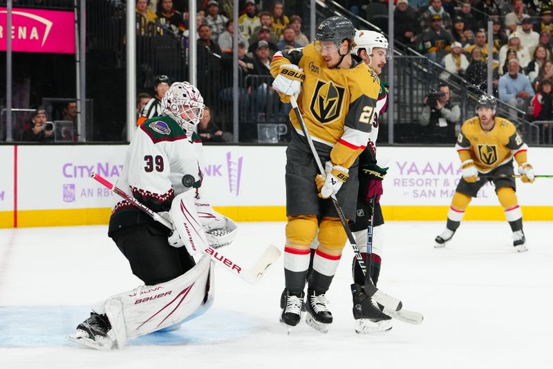 Nov 25, 2023; Las Vegas, Nevada, USA; Arizona Coyotes goaltender Connor Ingram (39) makes a save against a deflection by Vegas Golden Knights center Brett Howden (21) during the first period at T-Mobile Arena. Mandatory Credit: Stephen R. Sylvanie-USA TODAY Sports