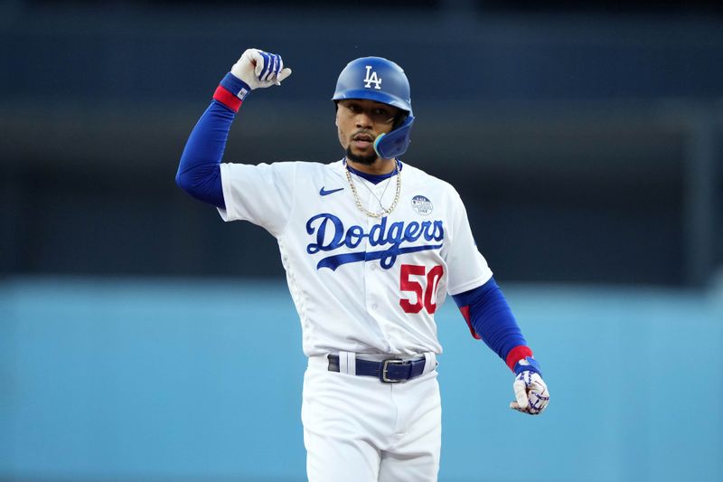 Jun 2, 2023; Los Angeles, California, USA; Los Angeles Dodgers right fielder Mookie Betts (50) celebrates in the first inning against the New York Yankees  at Dodger Stadium. Mandatory Credit: Kirby Lee-USA TODAY Sports