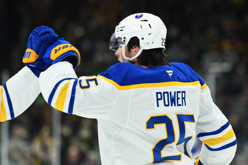 Mar 17, 2025; Boston, Massachusetts, USA;  Buffalo Sabres defenseman Owen Power (25) high fives a teammate after scoring a goal during the second period against the Boston Bruins at TD Garden. Mandatory Credit: Bob DeChiara-Imagn Images