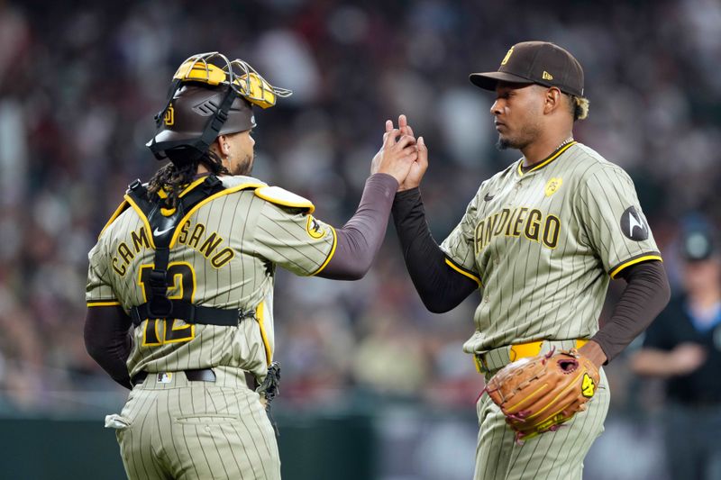 May 3, 2024; Phoenix, Arizona, USA; San Diego Padres catcher Luis Campusano (12) and San Diego Padres pitcher Jhony Brito (76) shakes hands after the ninth inning against the Arizona Diamondbacks at Chase Field. Mandatory Credit: Joe Camporeale-USA TODAY Sports