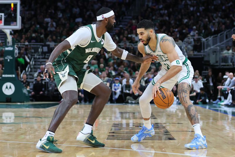 MILWAUKEE, WISCONSIN - NOVEMBER 10: Jayson Tatum #0 of the Boston Celtics is defended by Bobby Portis #9 of the Milwaukee Bucks during the second half of a game at Fiserv Forum on November 10, 2024 in Milwaukee, Wisconsin. NOTE TO USER: User expressly acknowledges and agrees that, by downloading and or using this photograph, User is consenting to the terms and conditions of the Getty Images License Agreement. (Photo by Stacy Revere/Getty Images)