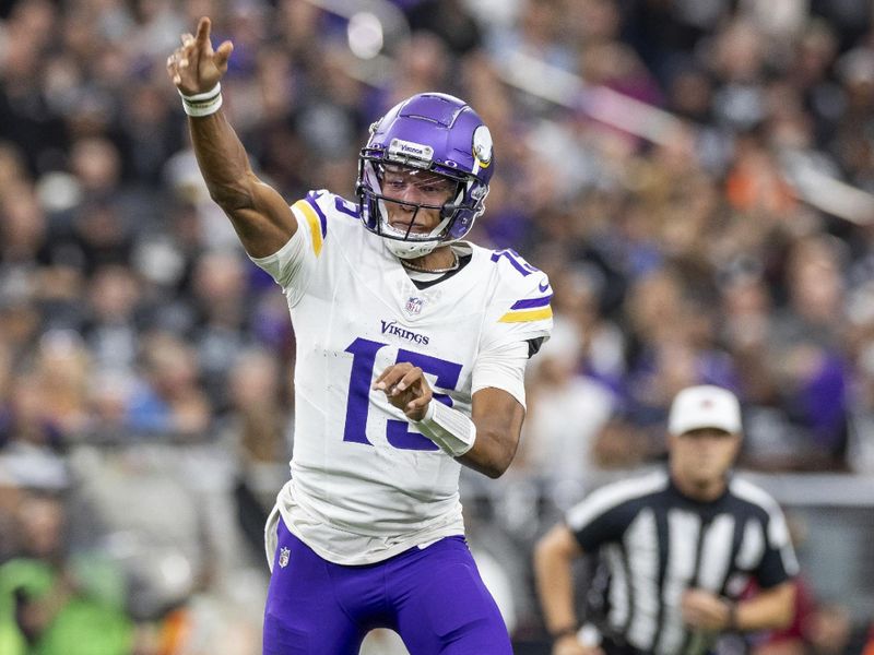 Minnesota Vikings quarterback Joshua Dobbs (15) passes the ball against the Las Vegas Raiders in an NFL football game, Sunday, Dec. 10, 2023, in Las Vegas, NV. Vikings defeat the Raiders 3-0. (AP Photo/Jeff Lewis)